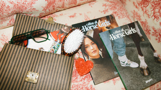 Gift add-ons including books, candles and candy at Plum Social Denver floral studio